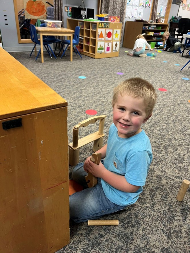 Child building with blocks in the classroom