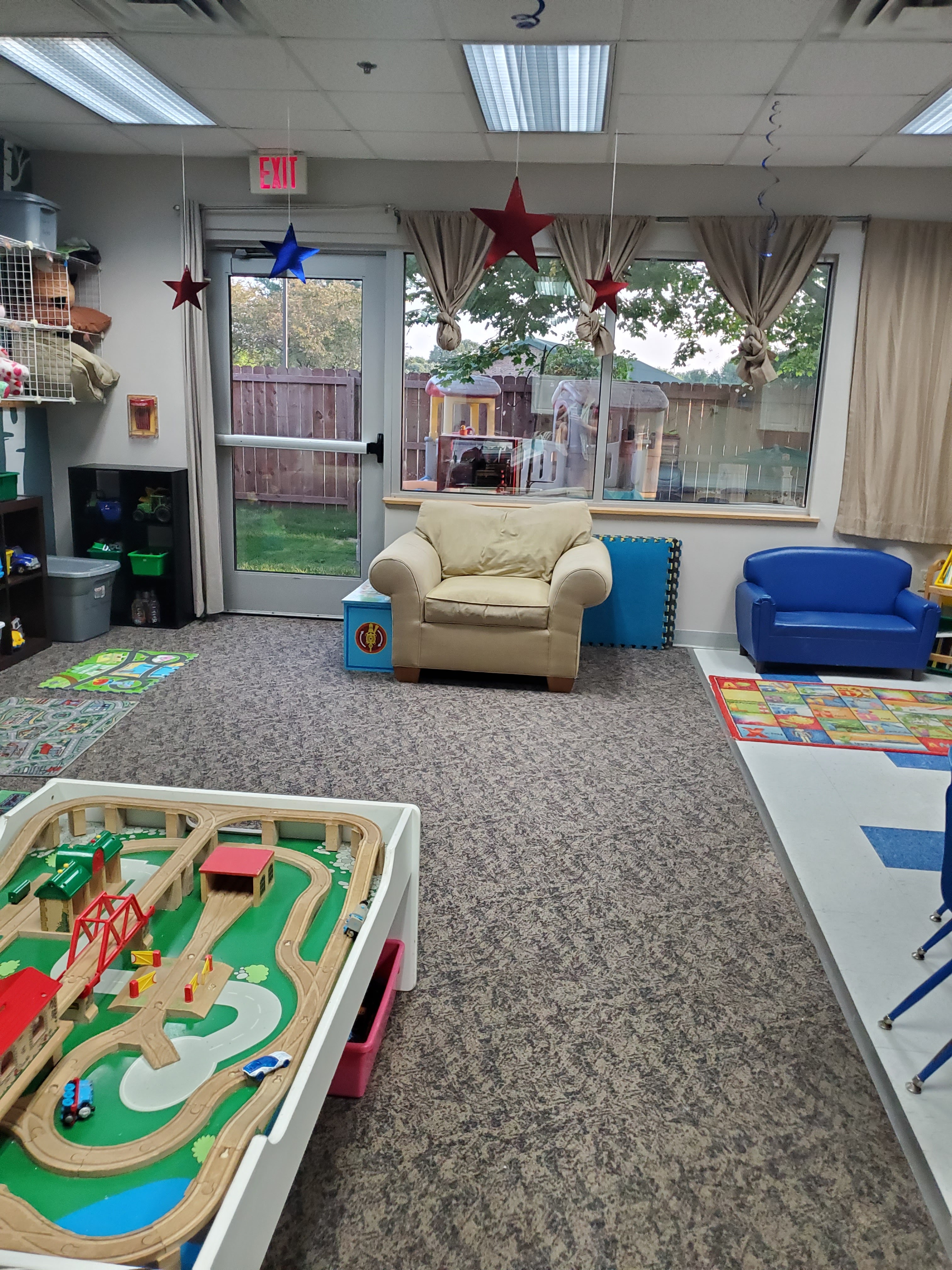 Cozy play area with train table and comfortable seating